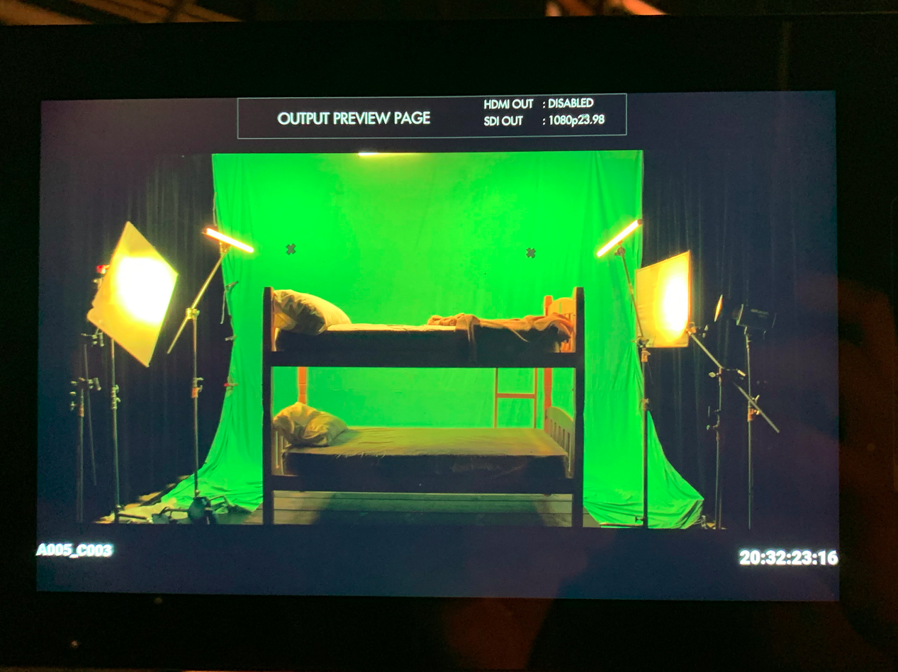 Camera monitor showing the Godly Boy green-screen set